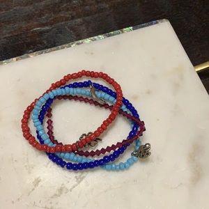 Four small charm bead stretchy bracelets